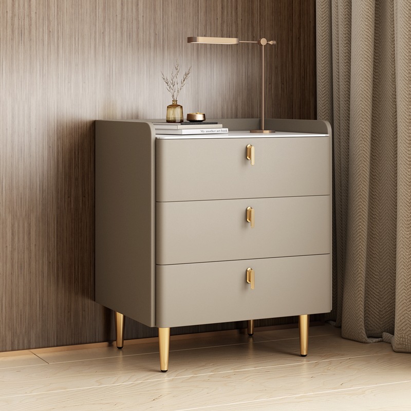 Three-drawer storage cabinet in a light finish